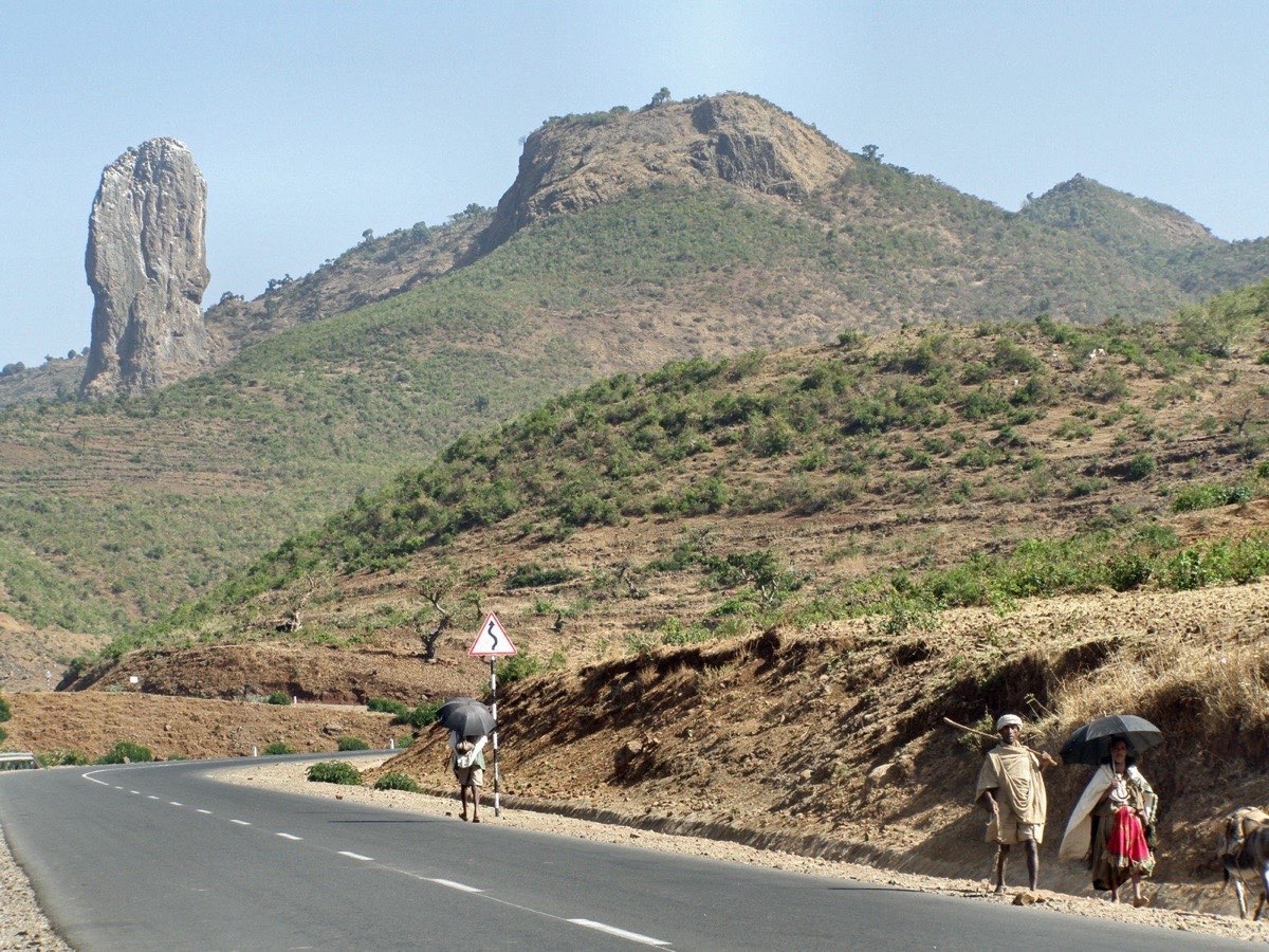 Mount Wehni, the monolith on the left, seen from the road between Addis Zemen and Gondar — the prison amba of the Ethiopian heirs whose summit Toy claimed as the first Westerner.